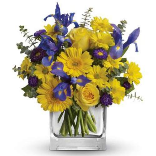 Summer Breeze - yellow and blue arrangement of flowers in a clear vase
