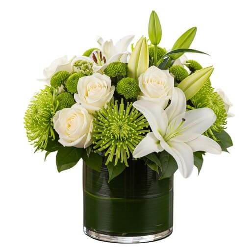 Devotion - white and green flowers arranged in a clear vase